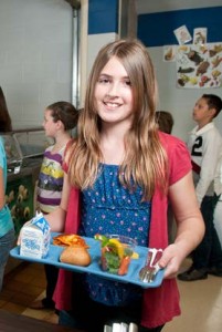 Child standing in a school lunch line